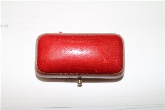 An 18ct gold mounted carved coral brooch, in fitted gilt tooled red leather box, 1.25in.